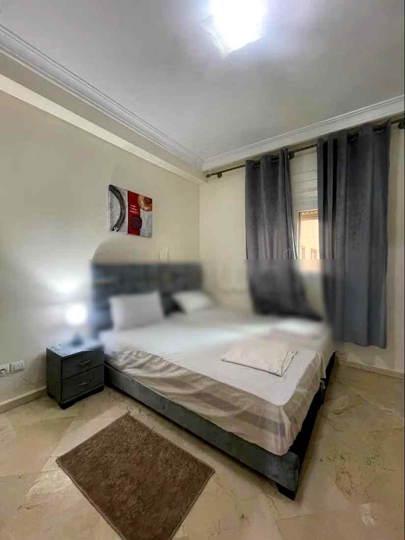 Location saisonnière à Guéliz. 2 chambres. Salon traditionnel marocain, résidence sécurisée